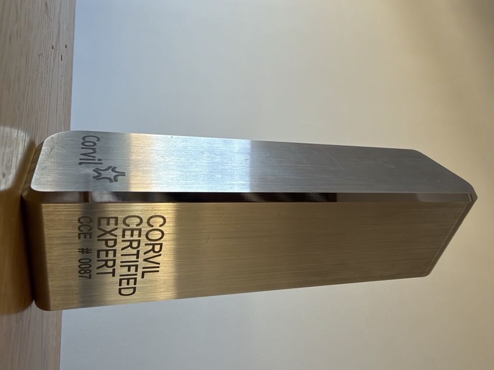 Corvil Certified Expert award, a brushed metal obelisk engraved "CORVIL CERTIFIED EXPERT, CCE # 0087"